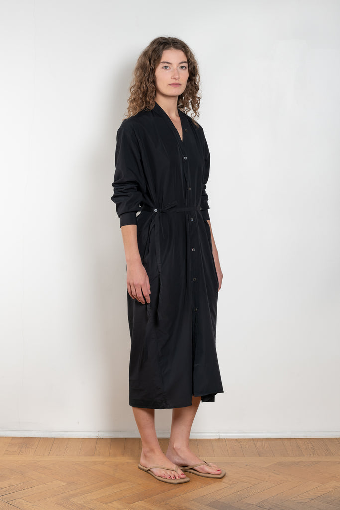 The Collarless Shirtdress by 6397 is a superfine cotton dress with a soft sheerness and full button closure