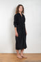 The Collarless Shirtdress by 6397 is a superfine cotton dress with a soft sheerness and full button closure