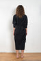 The Collarless Shirtdress by 6397 is a superfine cotton dress with a soft sheerness and full button closure