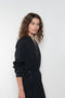 The Collarless Shirtdress by 6397 is a superfine cotton dress with a soft sheerness and full button closure