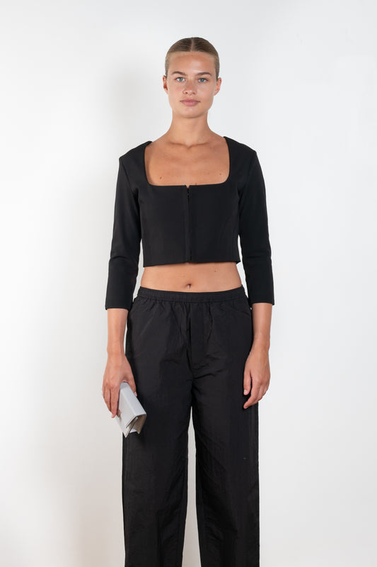 The Hooked Top 852 by Acne Studios is a cropped top with front hook and eye closure, a square-cut neckline and a zipper closure