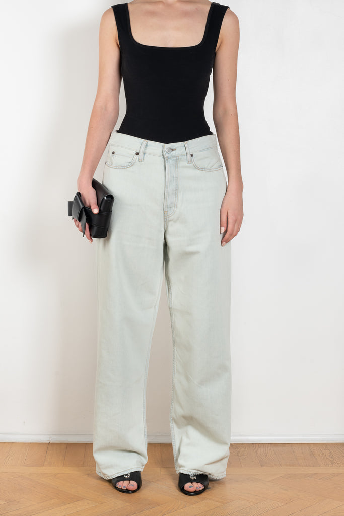 The 1981F Jeans by Acne Studios are cut to a loose fit with a low waist, wide leg and long length