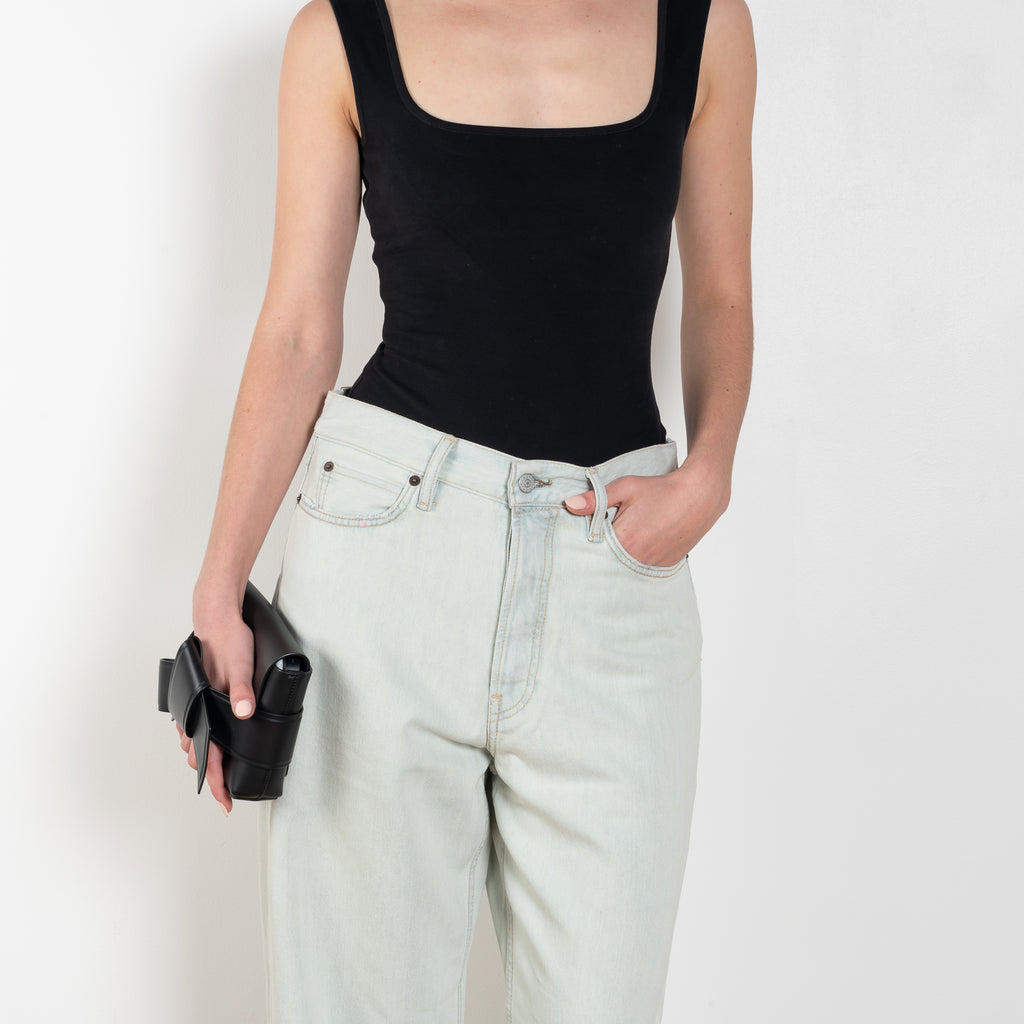 The 1981F Jeans by Acne Studios are cut to a loose fit with a low waist, wide leg and long length