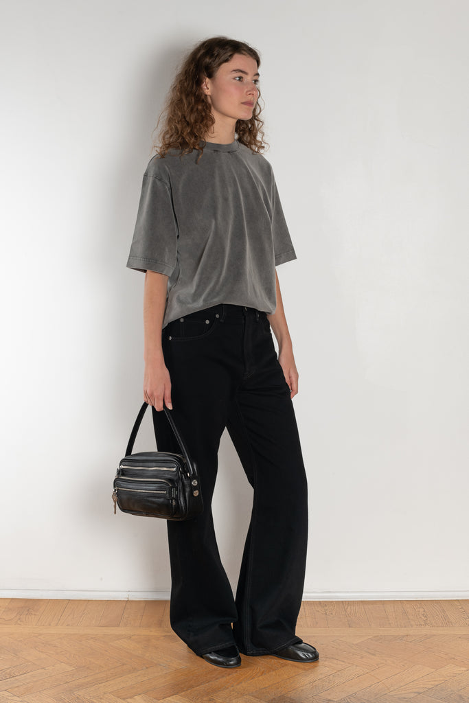 The 2021 Loose Fit Jeans by Acne Studios are cut to a loose fit with mid-waist, wide leg and long length. Made from rigid denim in a black black wash.