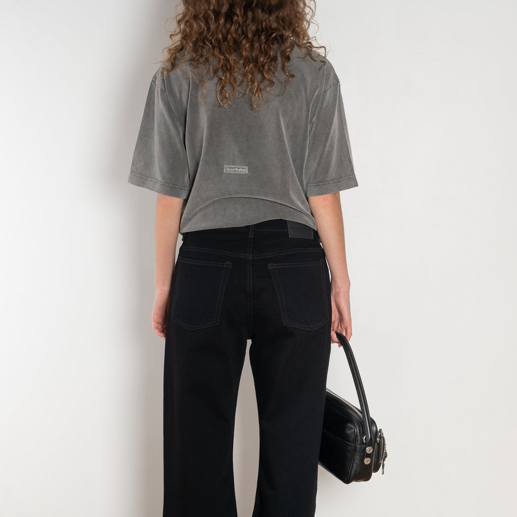 The 2021 Loose Fit Jeans by Acne Studios are cut to a loose fit with mid-waist, wide leg and long length. Made from rigid denim in a black black wash.