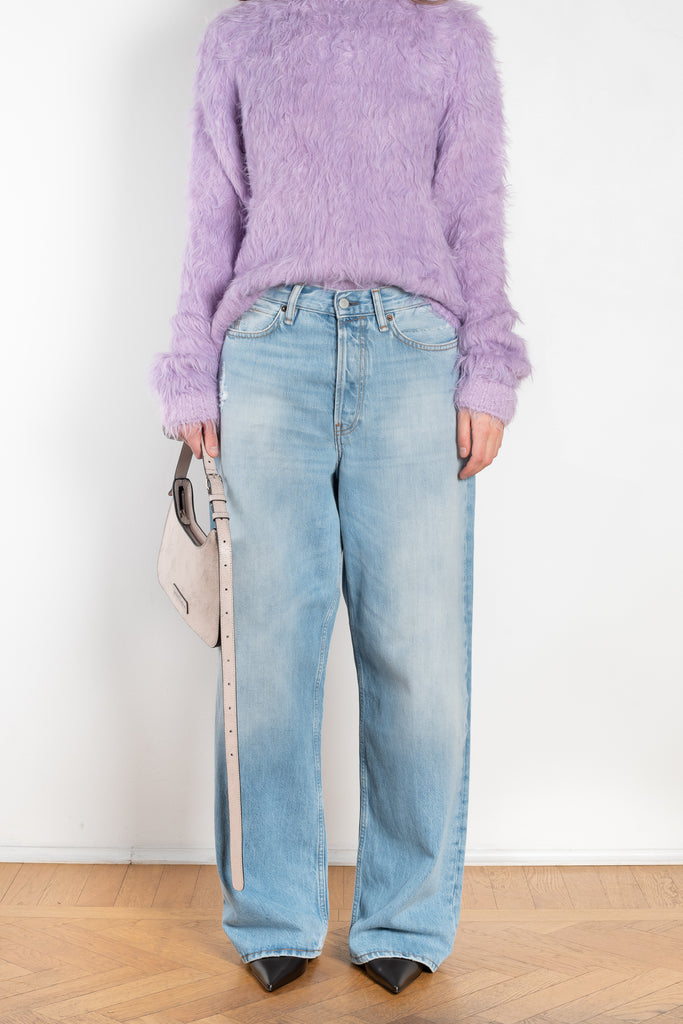 The 1981F Jeans by Acne Studios are cut to a loose fit with a low waist, wide leg and long length