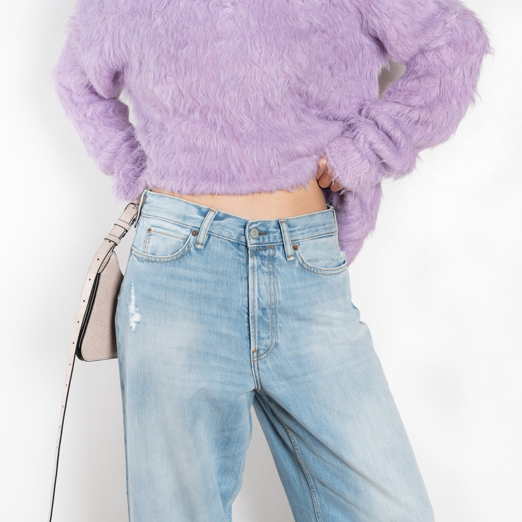 The 1981F Jeans by Acne Studios are cut to a loose fit with a low waist, wide leg and long length