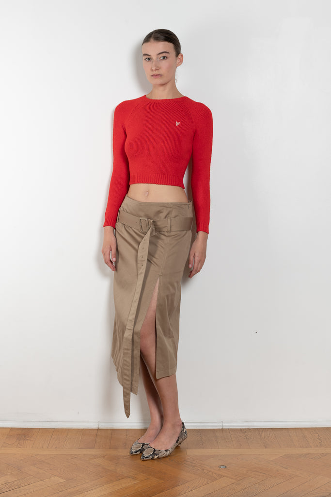 The Belted Twill Skirt by Acne Studios is crafted from classic cotton twill, featuring a trench-style belt at the hip with a leather buckle and embroidered eyelets