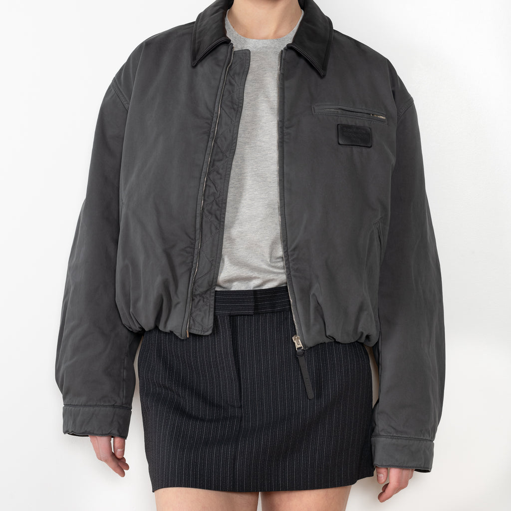 Bomber blouson jacket is crafted from twill cotton with a garment-dyed finish, an Acne Studios Stockholm 1996 logo patch at the front