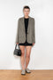The Check Suit Jacketby Acne Studios is a single-breasted suit jacket with a check bicolour pattern