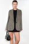 The Check Suit Jacketby Acne Studios is a single-breasted suit jacket with a check bicolour pattern
