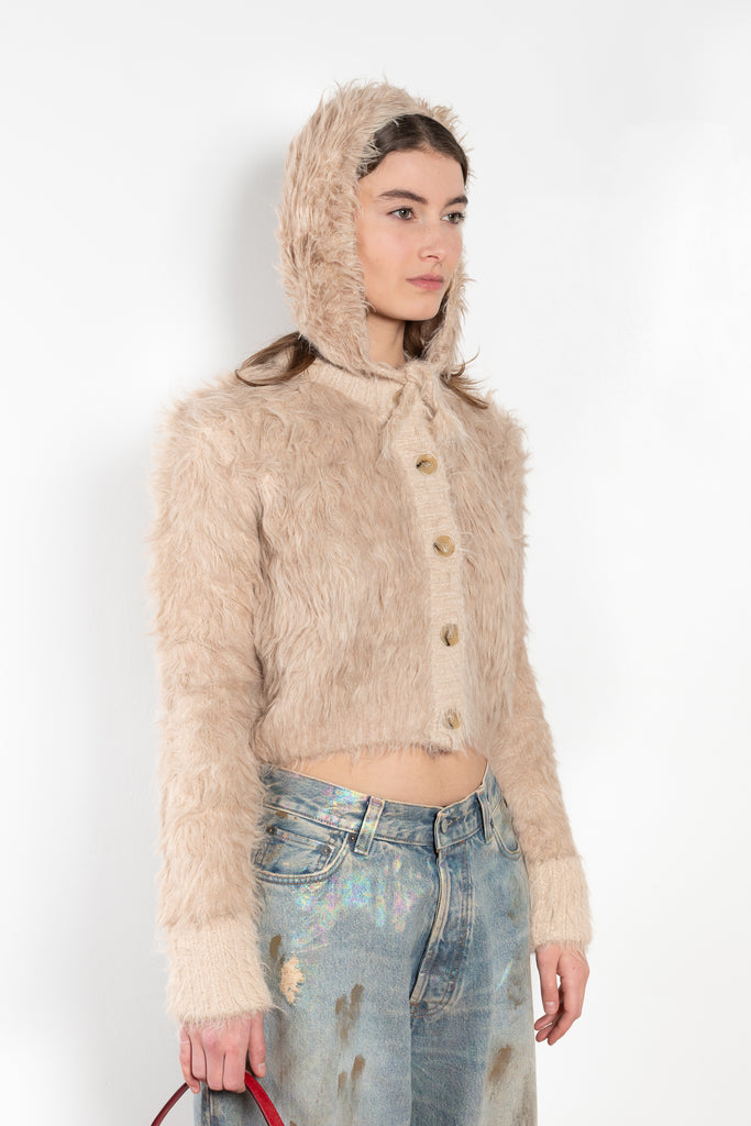 The Fluffy Hat by Acne Studios features a fluffy finish and soft hand-feel with ear straps and tie-up closure.