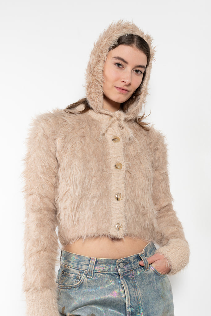 The Fluffy Hat by Acne Studios features a fluffy finish and soft hand-feel with ear straps and tie-up closure.