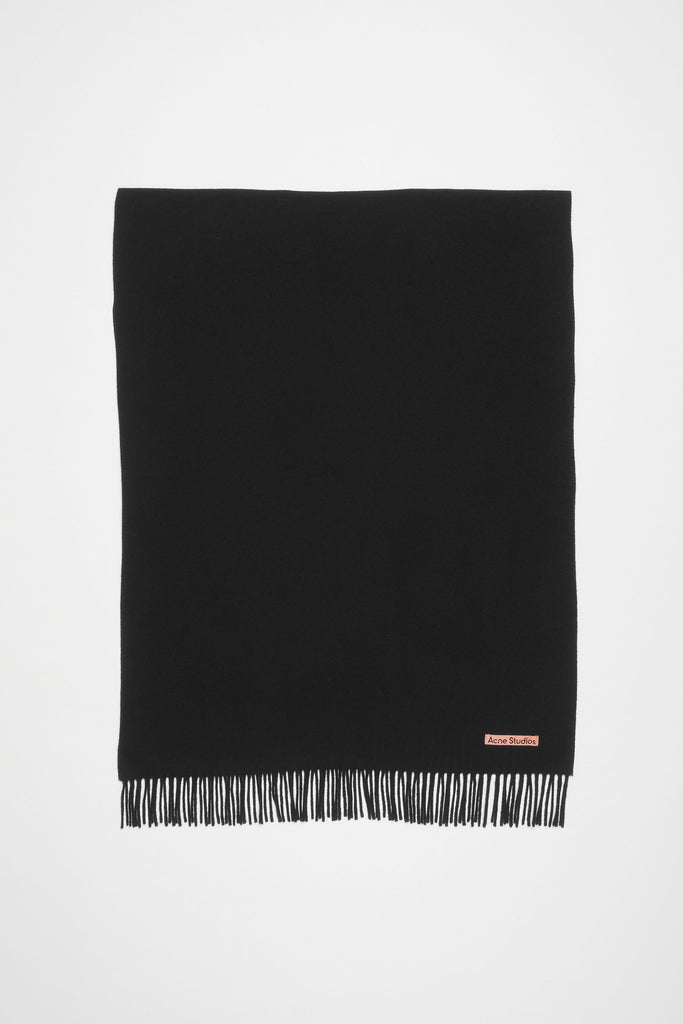 The Oversized Fringed Scarf by Acne Studios is crafted from midweight wool with a soft hand-feel, detailed with a pink Acne Studios label
