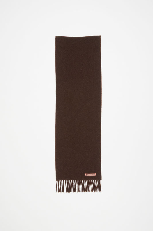 The Fringe Wool Scarf Skinny by Acne Studios is detailed with a pink Acne Studios label, crafted from midweight wool
