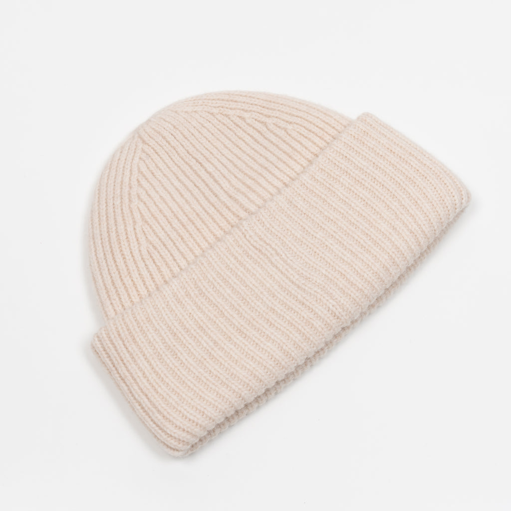 The Small Face Logo Beanie by Acne Studios features a small embroidered face logo patch and ribbed detailing, crafted from chunky wool.