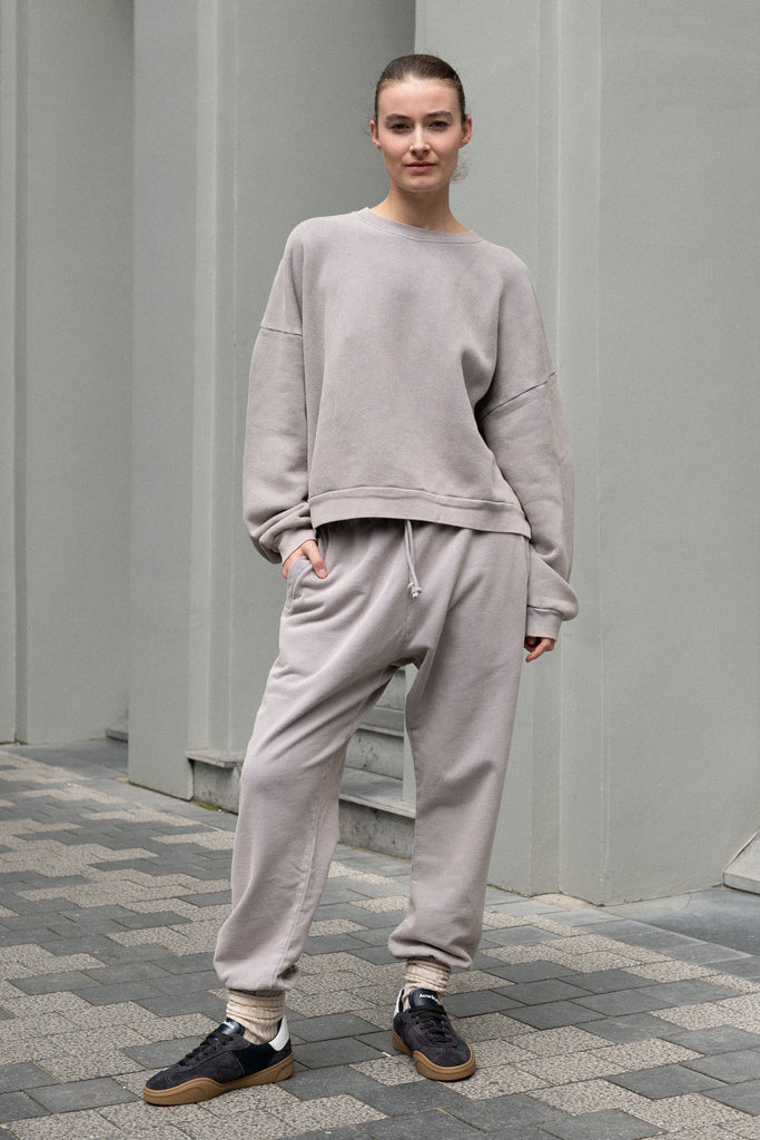 The Jogging 0015 by Acne Studios are mid waist joggers with an elastic waistband and a small rubber logo patch on the back center