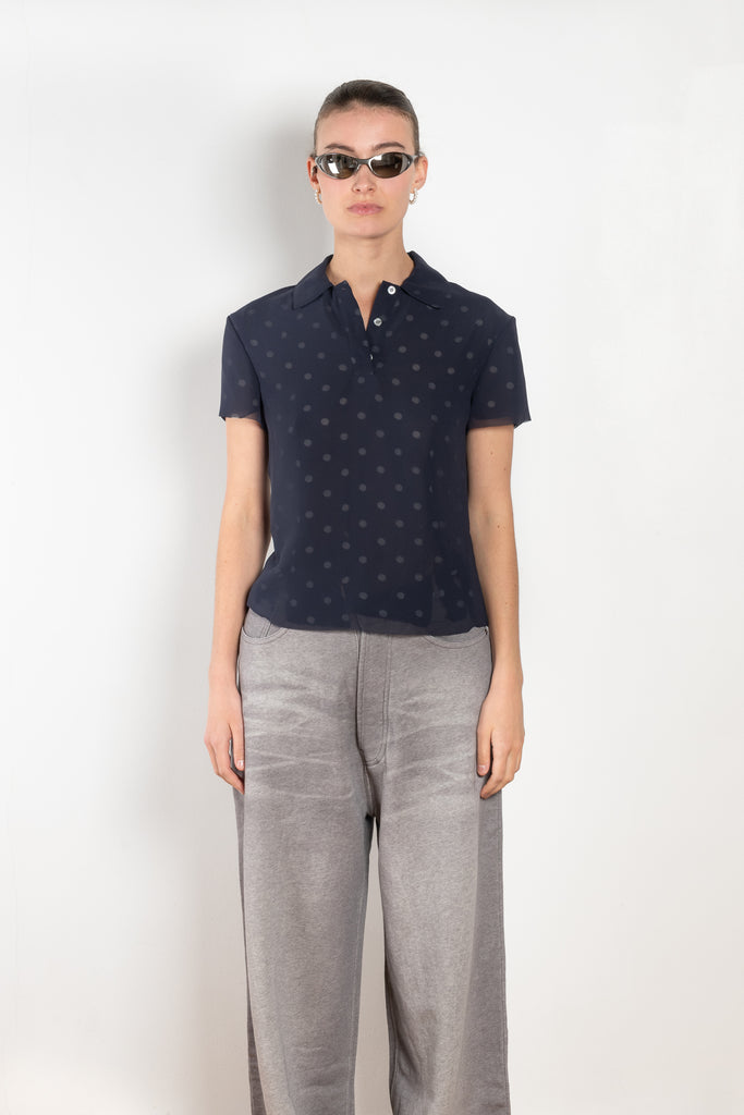 The Layered Tshirt by Acne Studios  features seasonal polka dot artwork, adorned with shredded cuts and double-layered mesh construction