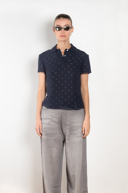 The Layered Tshirt by Acne Studios  features seasonal polka dot artwork, adorned with shredded cuts and double-layered mesh construction