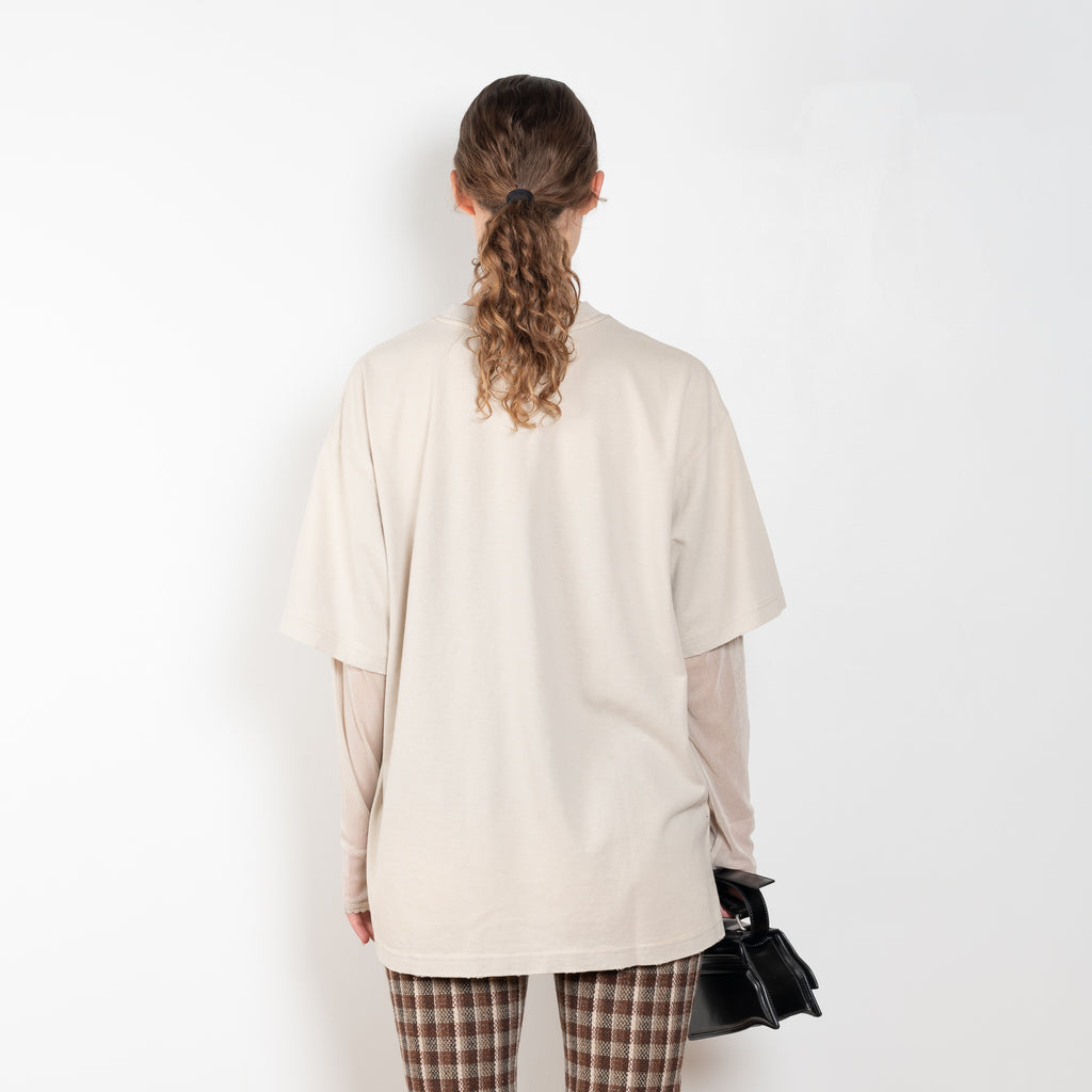 The Layered Tshirt by Acne Studios is a oversized Tee with a seasonal print and layered long sleeves in mesh