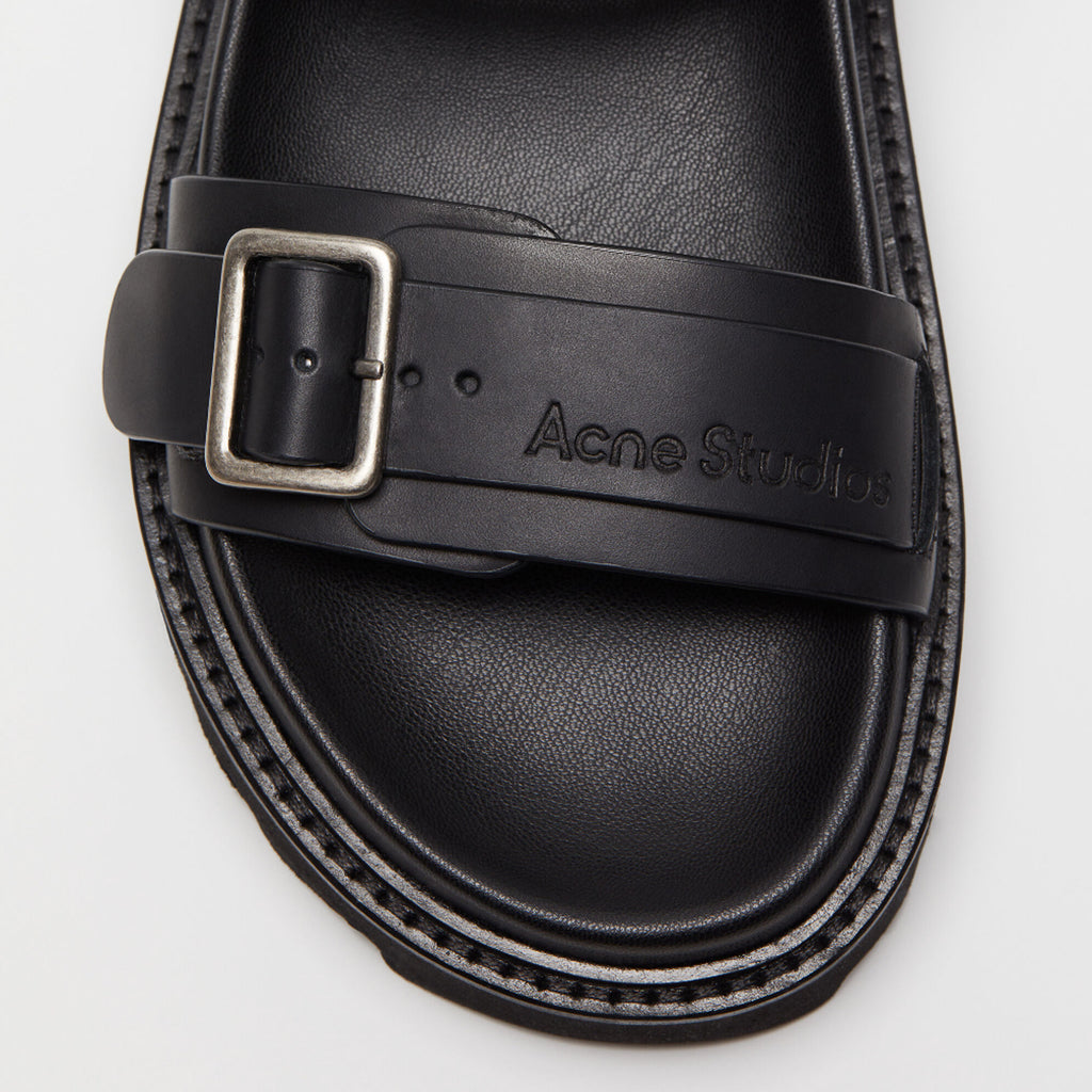 The Leather Buckle Sandal by Acne Studios is a strap sandals feature biker-inspired silver-tone metal buckles