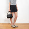 The Leather Buckle Shoes by Acne Studios are mule shoes crafted from soft nappa leather and detailed with branded buckles