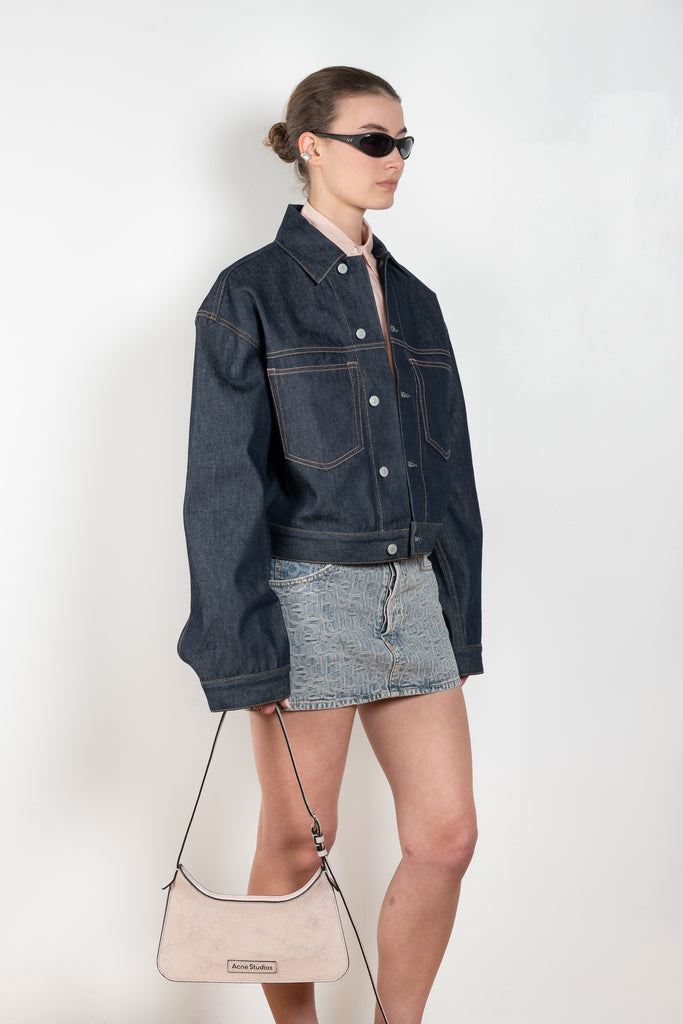 The Monogram Mini Skirt 643 by Acne Studios is cut to a regular fit with a straight shape, low waist and mini length