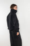 The Nylon Jacket by Acne Studios is crafted in a technical nylon with a peach finish. Constructed with a high neckline