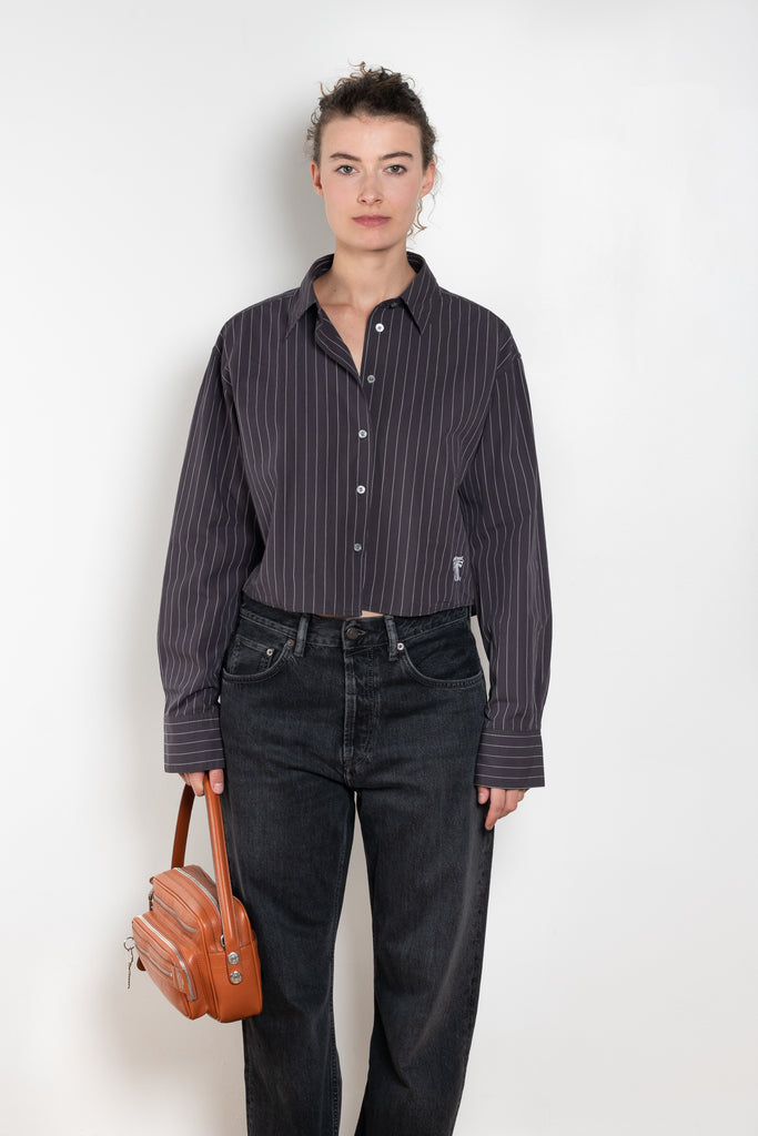 The Shirt Jacquard Pinstripe by Acne Studios is a button-up shirt in poplin cotton with a contrast bow embroidery