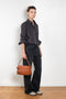 The Shirt Jacquard Pinstripe by Acne Studios is a button-up shirt in poplin cotton with a contrast bow embroidery