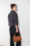 The Shirt Jacquard Pinstripe by Acne Studios is a button-up shirt in poplin cotton with a contrast bow embroidery