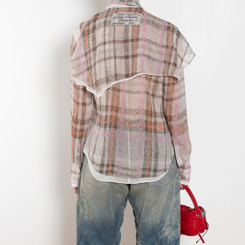 The Printed Silk Blouse by Acne Studios is crafted from lightweight silk with a trompe-l'oeil check print