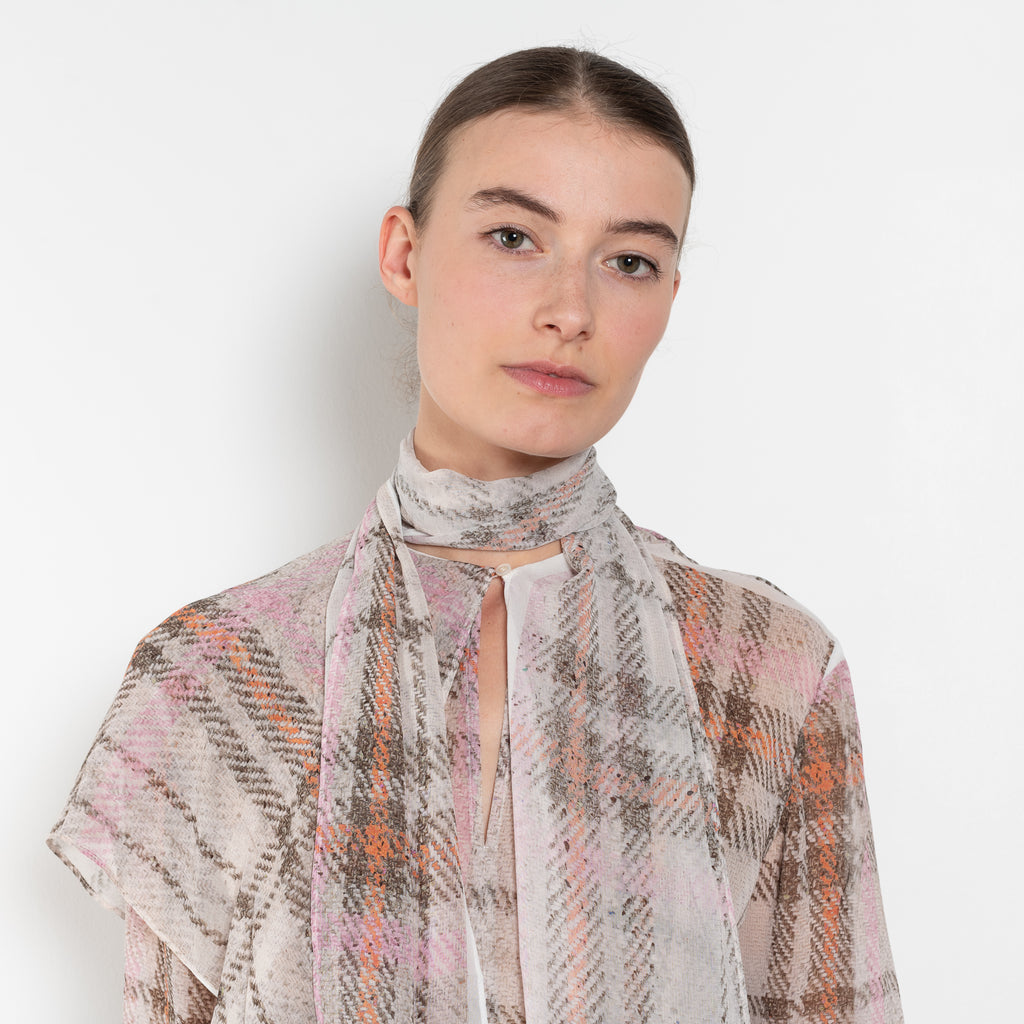 The Printed Silk Blouse by Acne Studios is crafted from lightweight silk with a trompe-l'oeil check print