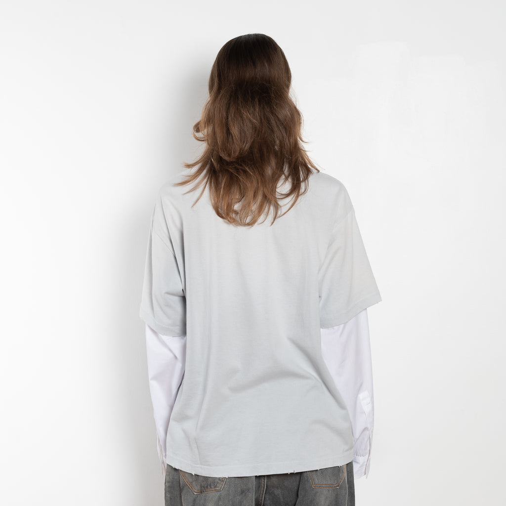 The Layered Print Tee by Acne Studios has a relaxed fit with under-layer mesh long sleeves and distressed neckline