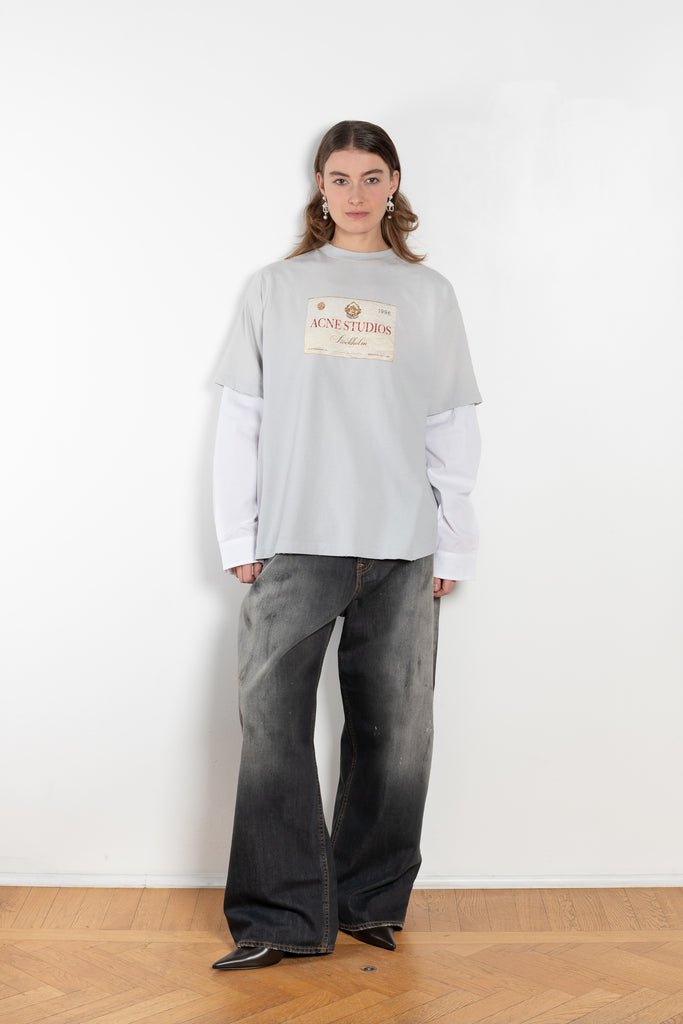 The Layered Print Tee by Acne Studios has a relaxed fit with under-layer mesh long sleeves and distressed neckline