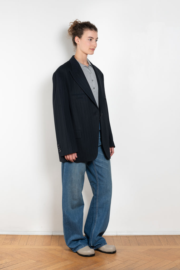The Single-breasted suit jacket by Acne Studios is crafted in a dense sartorial pinstripe fabric