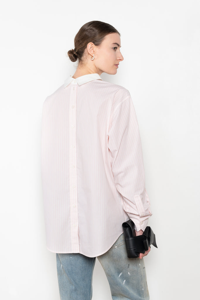 The Back and Front Buttoned Shirt by Acne Studios is cut to a relaxed fit and below hip length with back and front buttoning