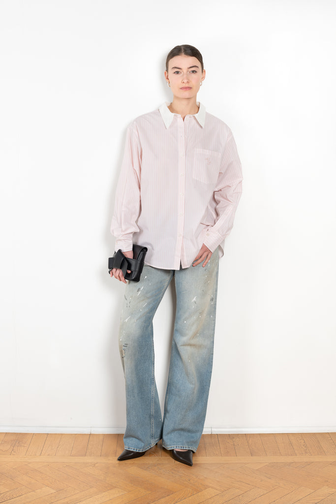 The Back and Front Buttoned Shirt by Acne Studios is cut to a relaxed fit and below hip length with back and front buttoning