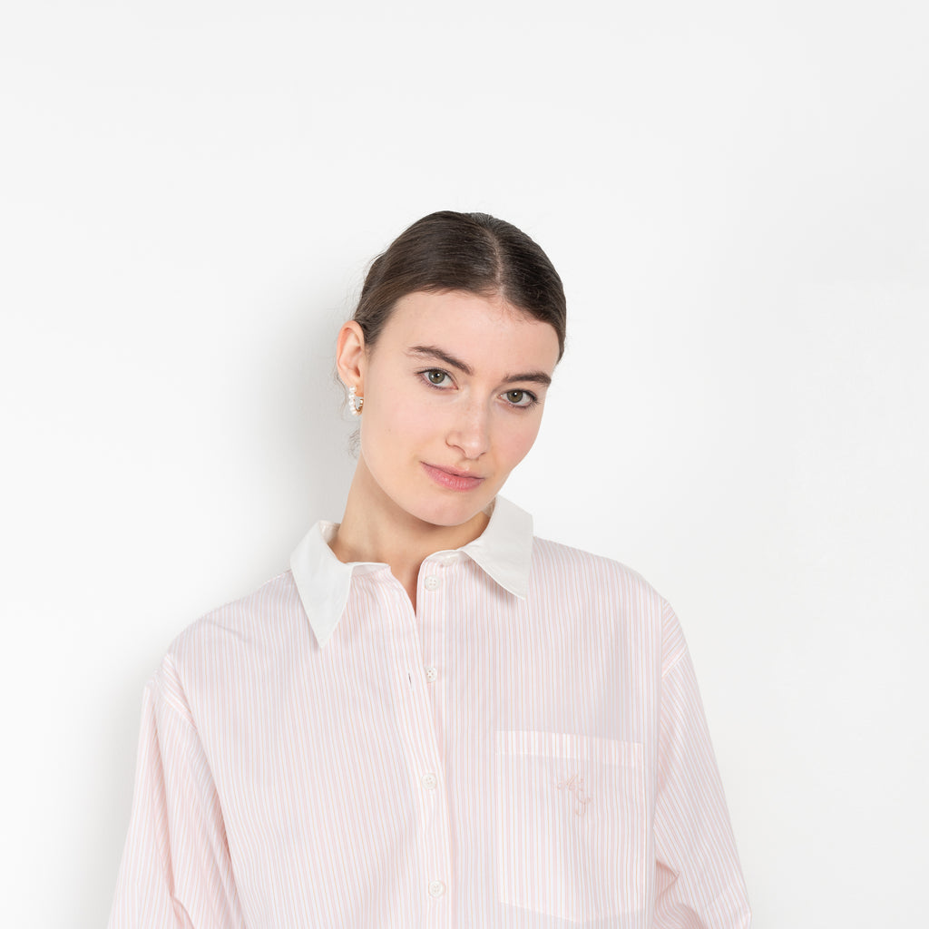 The Back and Front Buttoned Shirt by Acne Studios is cut to a relaxed fit and below hip length with back and front buttoning
