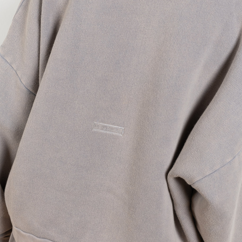 The Sweat 0017 by Acne Studios is a signature sweater with a small rubber logo patch on the back