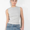 The Binx Tank by Agolde is high neckline top with a ribbed texture that enhances the close fit