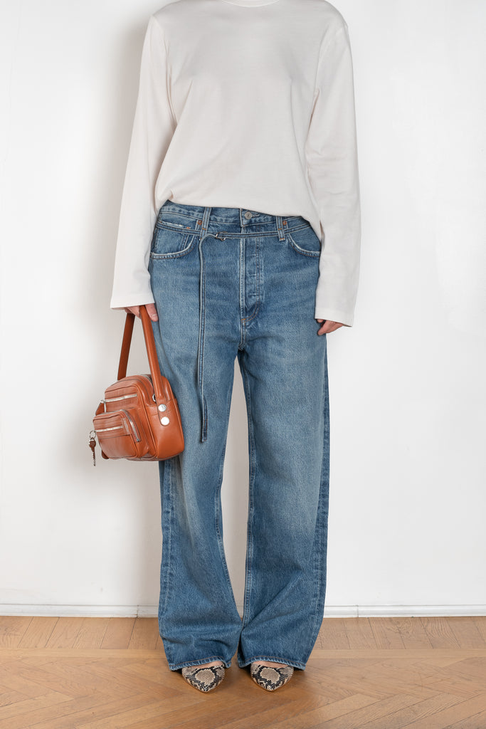 The Emmi Jean by Agolde has a long inseam, perfect for a slouchy look, and is cinched with a thin denim belt for added style