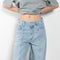 The Kristen Jeans by Agolde is a mid rise jeans with a front seam and added volume and a bow shaped leg