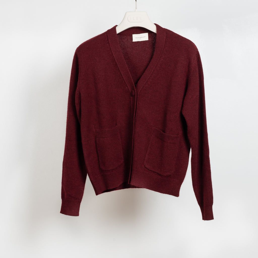 The Granny Cardigan by Alexandra Golovanoff is a signature V-neck cashmere cardigan with cashmere covered buttons