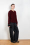 The Mathilde Crop Sweater by Alexandra Golovanoff is a signature V-neck sweater with a relaxed fit