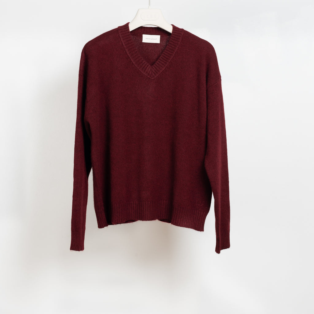 The Mathilde Crop Sweater by Alexandra Golovanoff is a signature V-neck sweater with a relaxed fit