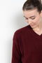 The Mathilde Crop Sweater by Alexandra Golovanoff is a signature V-neck sweater with a relaxed fit