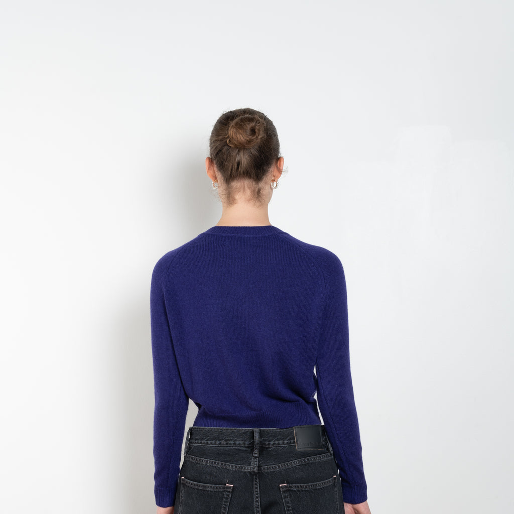 The Mini Mila Sweater by Alexandra Golovanoff is a signature round neck sweater with a shorter cut for a fitted look