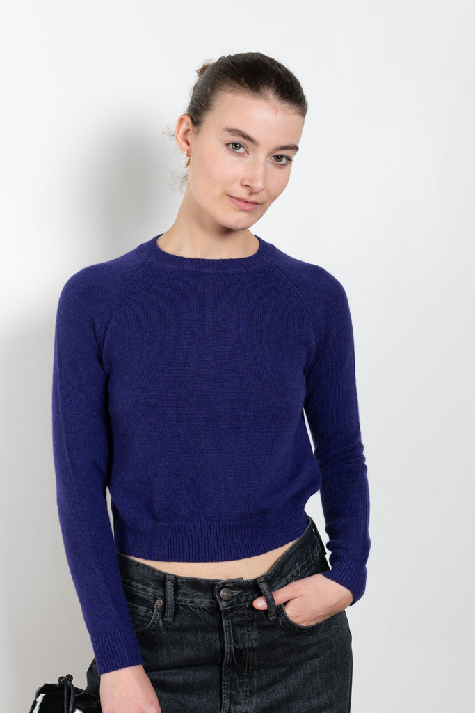 The Mini Mila Sweater by Alexandra Golovanoff is a signature round neck sweater with a shorter cut for a fitted look