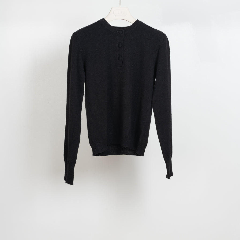 The Paul Henley by&nbsp;Alexandra Golovanoff is a lightweight cashmere sweater with a henley collar and cashmere covered buttons